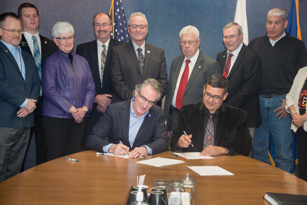 Governor Burgum and MHA Chairman Fox sign an oil tax revenue sharing compact